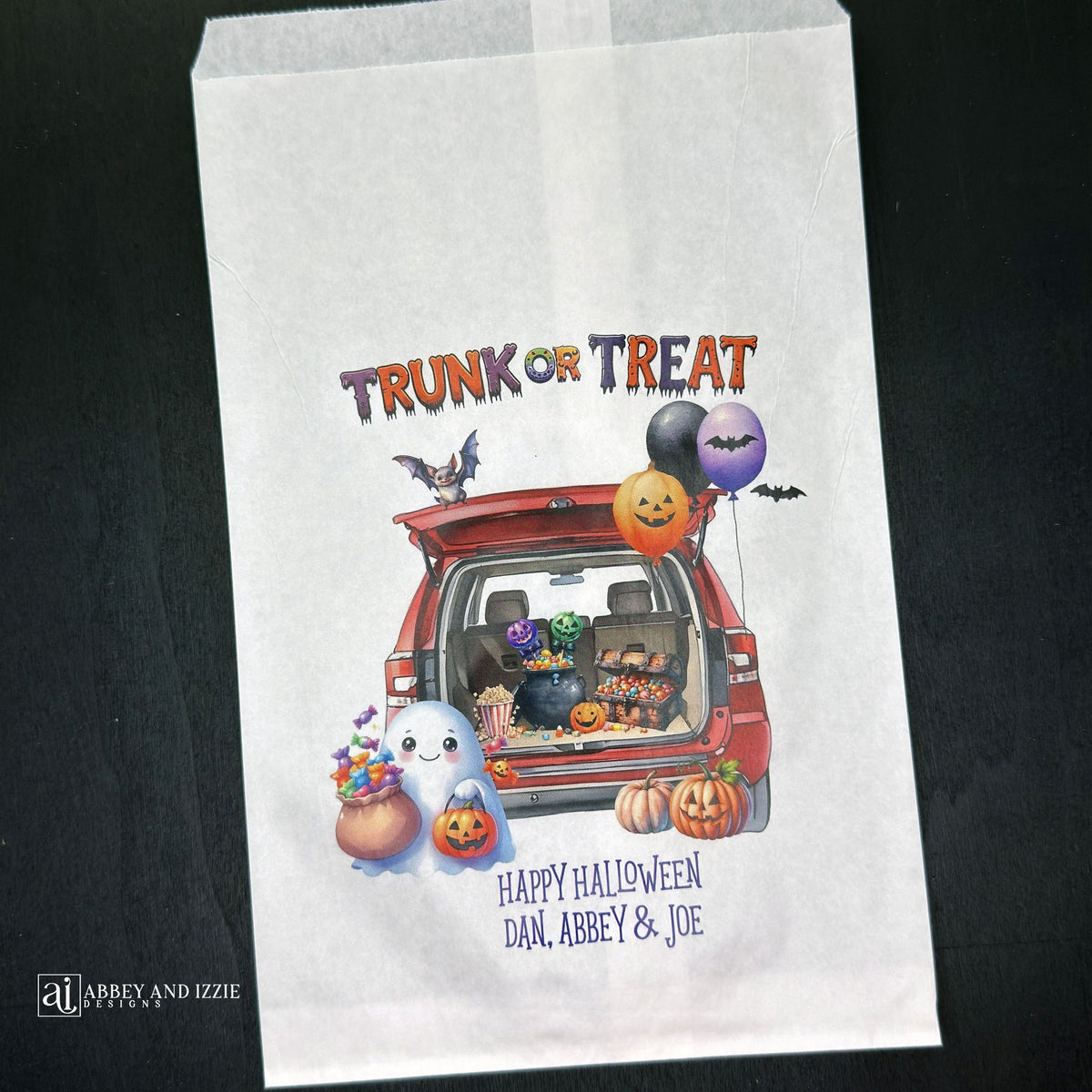 Personalize your trunk-or-treat celebration bags, make each trick-or-treater feel special. These durable, treat bags feature 'Happy Halloween' and your names, perfect for neighborhood events, school celebrations, or family gatherings.  Printed on white paper bags with Trunk or Treat at the top, a car with back open for the event.  Filled with cute Halloween decorations. 