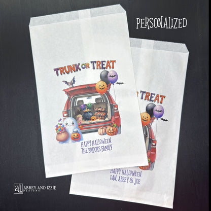 Personalize your trunk-or-treat celebration bags, make each trick-or-treater feel special. These durable, treat bags feature 'Happy Halloween' and your names, perfect for neighborhood events, school celebrations, or family gatherings.  Printed on white paper bags with Trunk or Treat at the top, a car with back open for the event.  Filled with cute Halloween decorations.  
