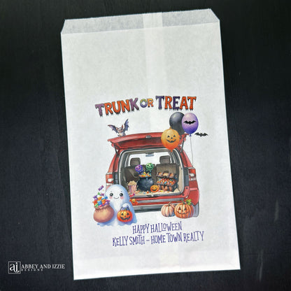 Personalize your trunk-or-treat celebration bags, make each trick-or-treater feel special. These durable, treat bags feature 'Happy Halloween' and your names, perfect for neighborhood events, school celebrations, or family gatherings.  Printed on white paper bags with Trunk or Treat at the top, a car with back open for the event.  Filled with cute Halloween decorations.  