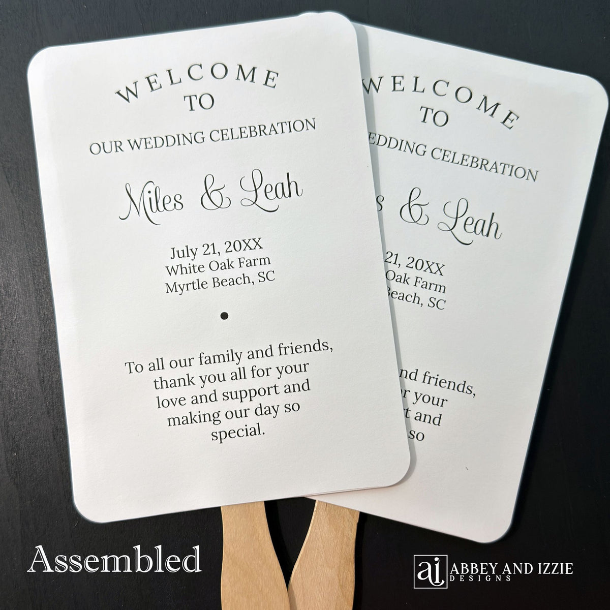 Wedding program fans printed with names, date, a thank you plus your ceremony order and the wedding party.  Fans are printed and shipped to you assembled for your special day.  Printed on white cardstock with black text, rounded corners with a wooden handle hidden between the two layers of cardstock.