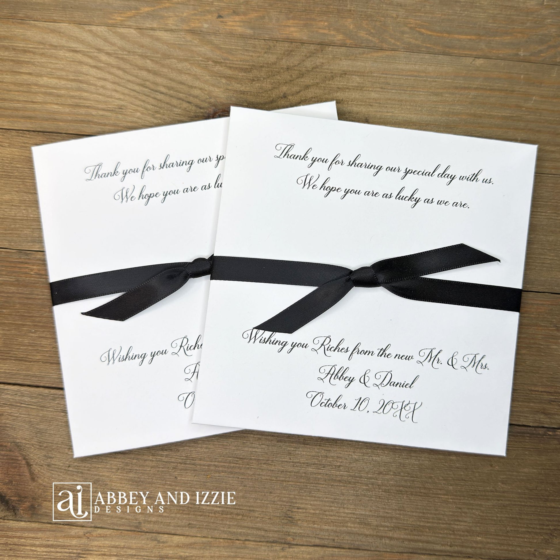 Wishing You Riches wedding favors personalized with a special message to your guests. Our lottery ticket envelopes come fully assembled, printed on white cardstock with ribbon attached, your choice of&nbsp; ribbon colors to match your wedding theme. Wedding guest favors measure 5" x 5", plenty of room for a scratch off lotto ticket or the perfect size to slide in a custom coaster. Lottery tickets are not included with your purchase of our Wishing You Riches Wedding Favors Personalized.