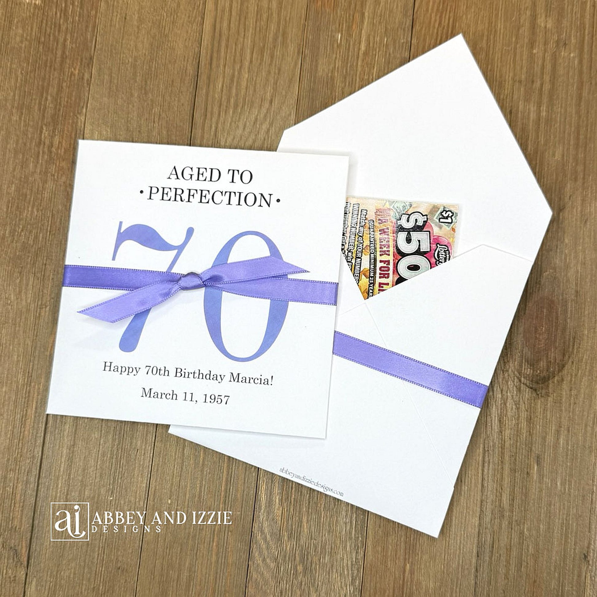 These interactive Aged to Perfection scratch-off holders transform birthday celebrations into memorable moments. Guests scratch off the lottery ticket inside to reveal who the big winner is!&nbsp; Perfect for 50th, 60th, 70th birthdays, available for any birthday. Fully customizable with name, dates, and special messages tailored to the guest of honor. Printed on sturdy white cardstock ensures durability throughout your party. Your choice of large number color as well as the ribbon color to match your party