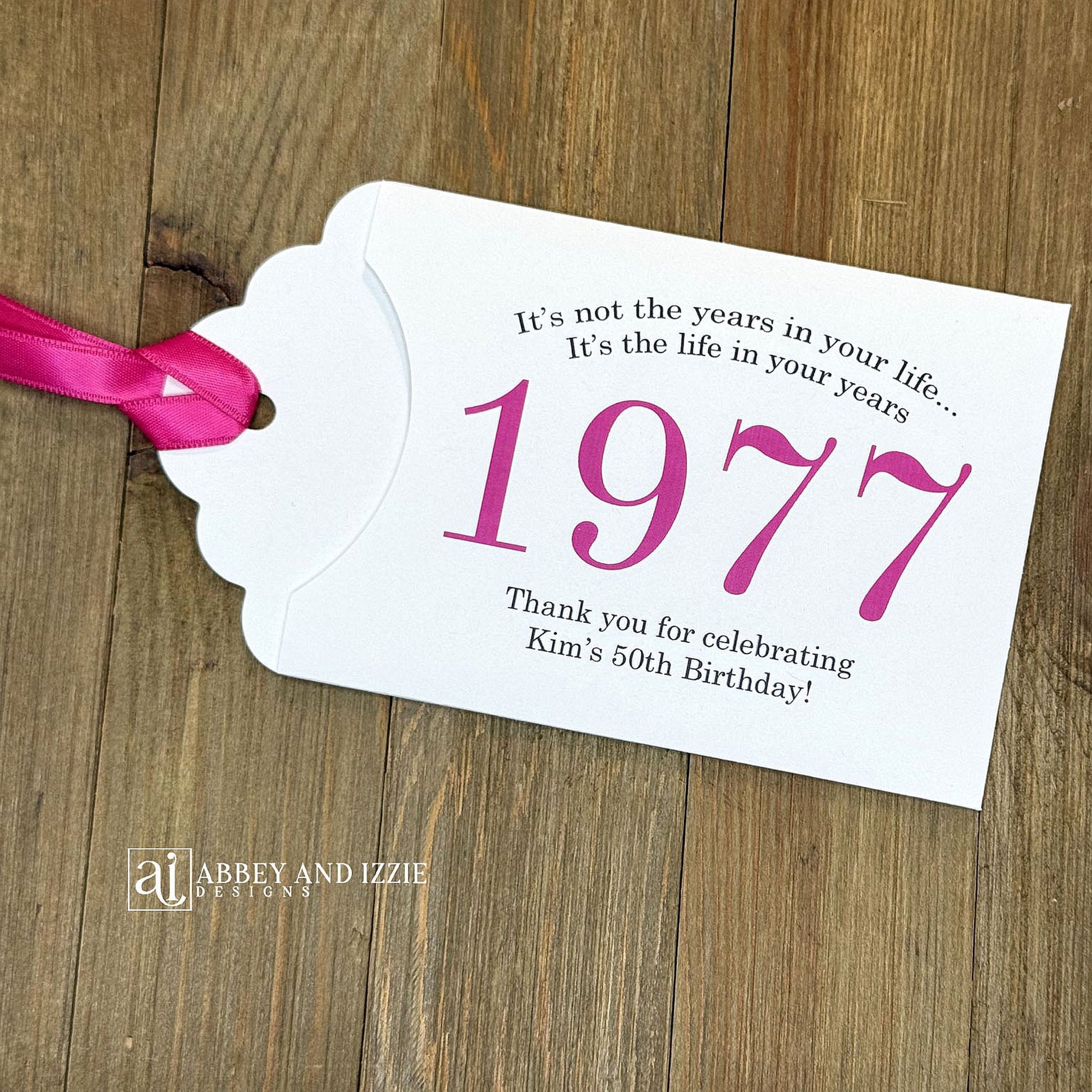 Personalized scratch-off birthday favors for adults. Each envelope features a special message with the year the guest of honor was born in color. Including a thank you for celebrating with the us. Works for milestone birthdays, adult parties, and special events see our store for more options. Constructed from white high-quality cardstock with your choice of year color and ribbon color, which comes attached.