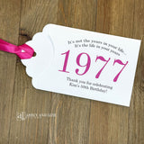 Personalized scratch-off birthday favors for adults. Each envelope features a special message with the year the guest of honor was born in color. Including a thank you for celebrating with the us. Works for milestone birthdays, adult parties, and special events see our store for more options. Constructed from white high-quality cardstock with your choice of year color and ribbon color, which comes attached.