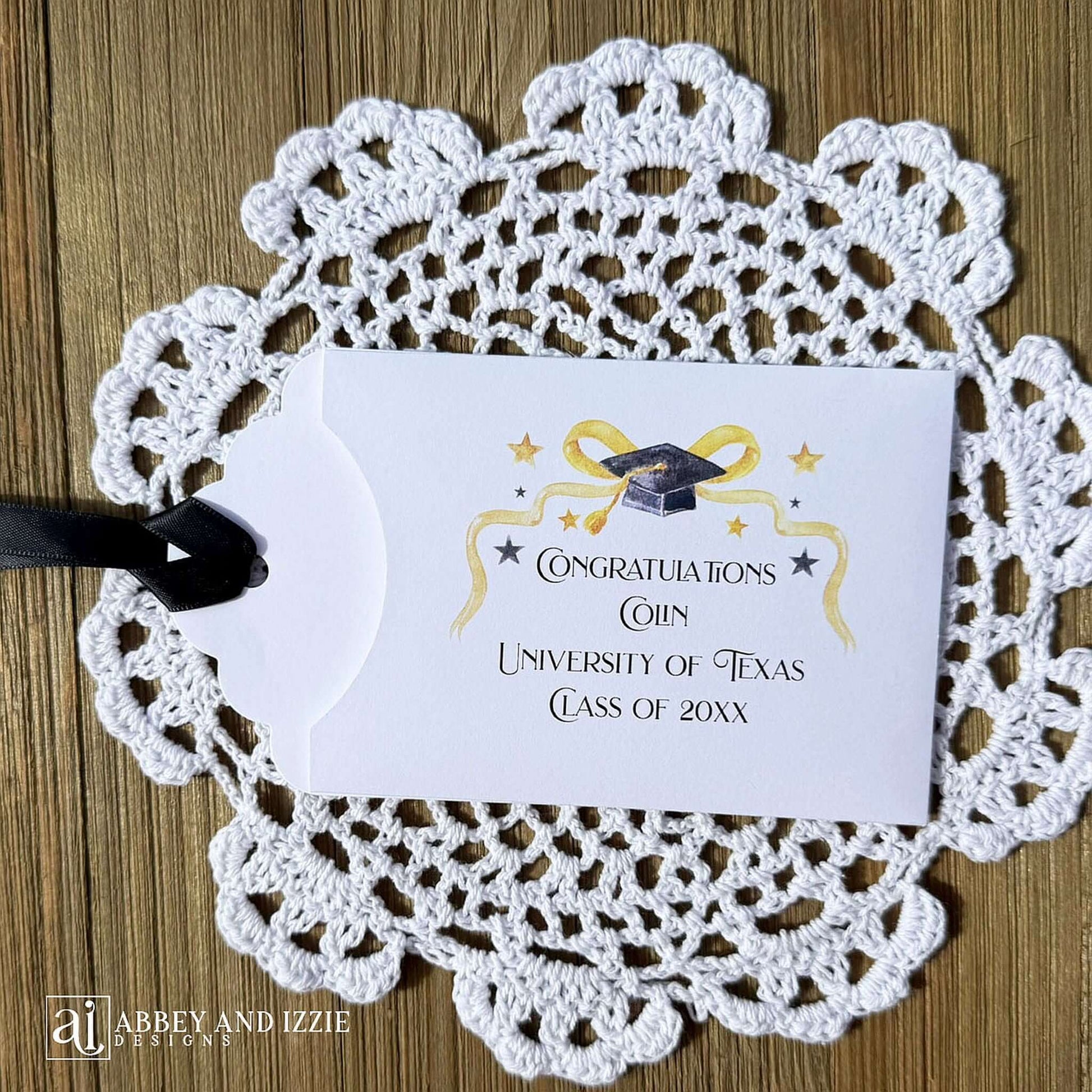 Scratch off Graduation Party Favors, printed on white card stock adorned with gold and black graduation elements.  Personalized for the guest of honor with congratulations.  Choice of black or gold ribbon which comes attahced.  Slide a lotto ticket in the open end of these envelopes for a fun party favor.