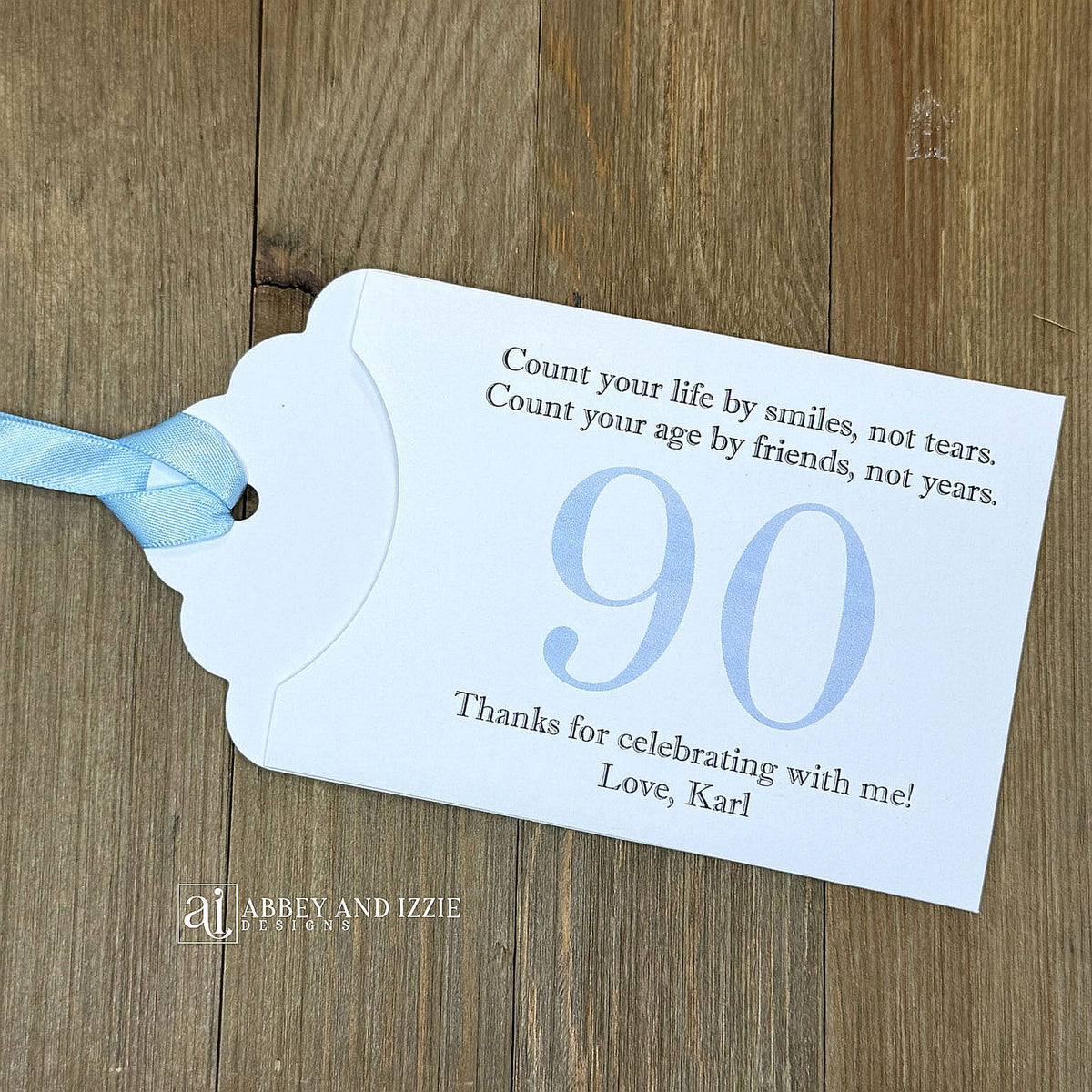 Celebrate with milestone birthday party guest favors that they will treasure. Each favor is customized with names, dates and a special messages to make your event unforgettable. Perfect for 30th, 40th, 50th, and beyond—these keepsakes add a personal touch to any milestone celebration.&nbsp; &nbsp;Printed on white cardstock with your choice of large number and ribbon color to match your party theme.