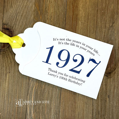 Personalized scratch-off birthday favors for adults. Each envelope features a special message with the year the guest of honor was born in color. Including a thank you for celebrating with the us. Works for milestone birthdays, adult parties, and special events see our store for more options. Constructed from white high-quality cardstock with your choice of year color and ribbon color, which comes attached.