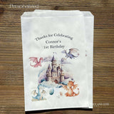 Delight your young dragon enthusiasts with these personalized birthday favor bags—the perfect way to send guests home with a magical memento. Each dragon birthday favor bag can be customized with your child's name and birth year.  Printed on white bags and adorned with a magical castle and cute colorful dragons.