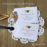 Scratch off Graduation Party Favors, printed on white card stock adorned with gold and black graduation elements.  Personalized for the guest of honor with congratulations.  Choice of black or gold ribbon which comes attahced.  Slide a lotto ticket in the open end of these envelopes for a fun party favor.