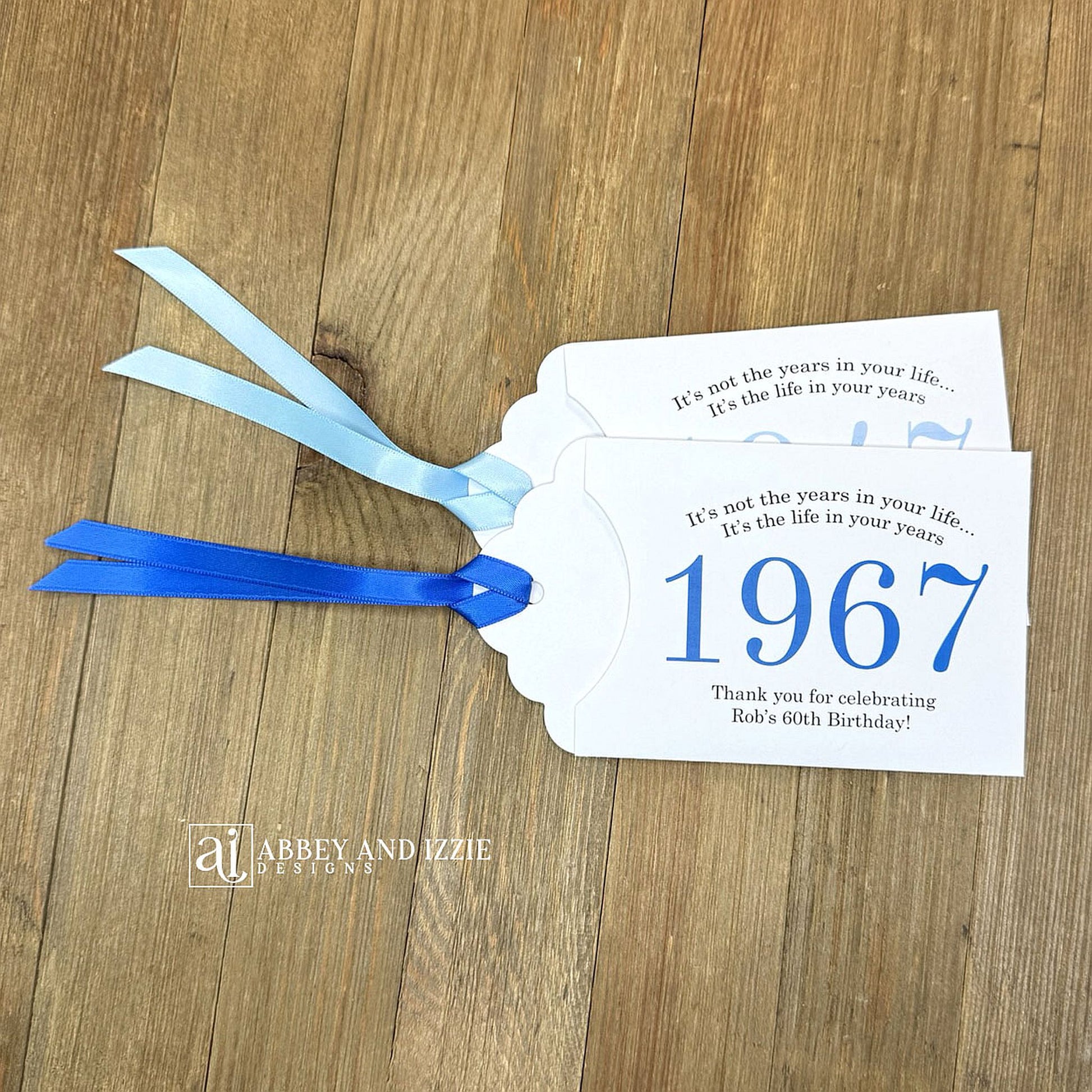 Personalized scratch-off birthday favors for adults. Each envelope features a special message with the year the guest of honor was born in color. Including a thank you for celebrating with the us. Works for milestone birthdays, adult parties, and special events see our store for more options. Constructed from white high-quality cardstock with your choice of year color and ribbon color, which comes attached.