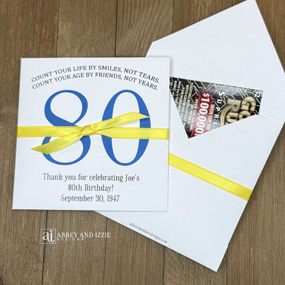 Scratch Off Birthday Party Favors add an interactive element to your celebration. Guests will find a scratch off ticket tucked inside—perfect for keeping everyone entertained. Ideal for birthday parties of any size, these customizable favors work as icebreakers or thank-you gifts. Printed on durable white cardstock ensures they hold up through the party. Personalize with names, date, and a sweet message.&nbsp; Choice of birthday number color and ribbon color to match your party theme.