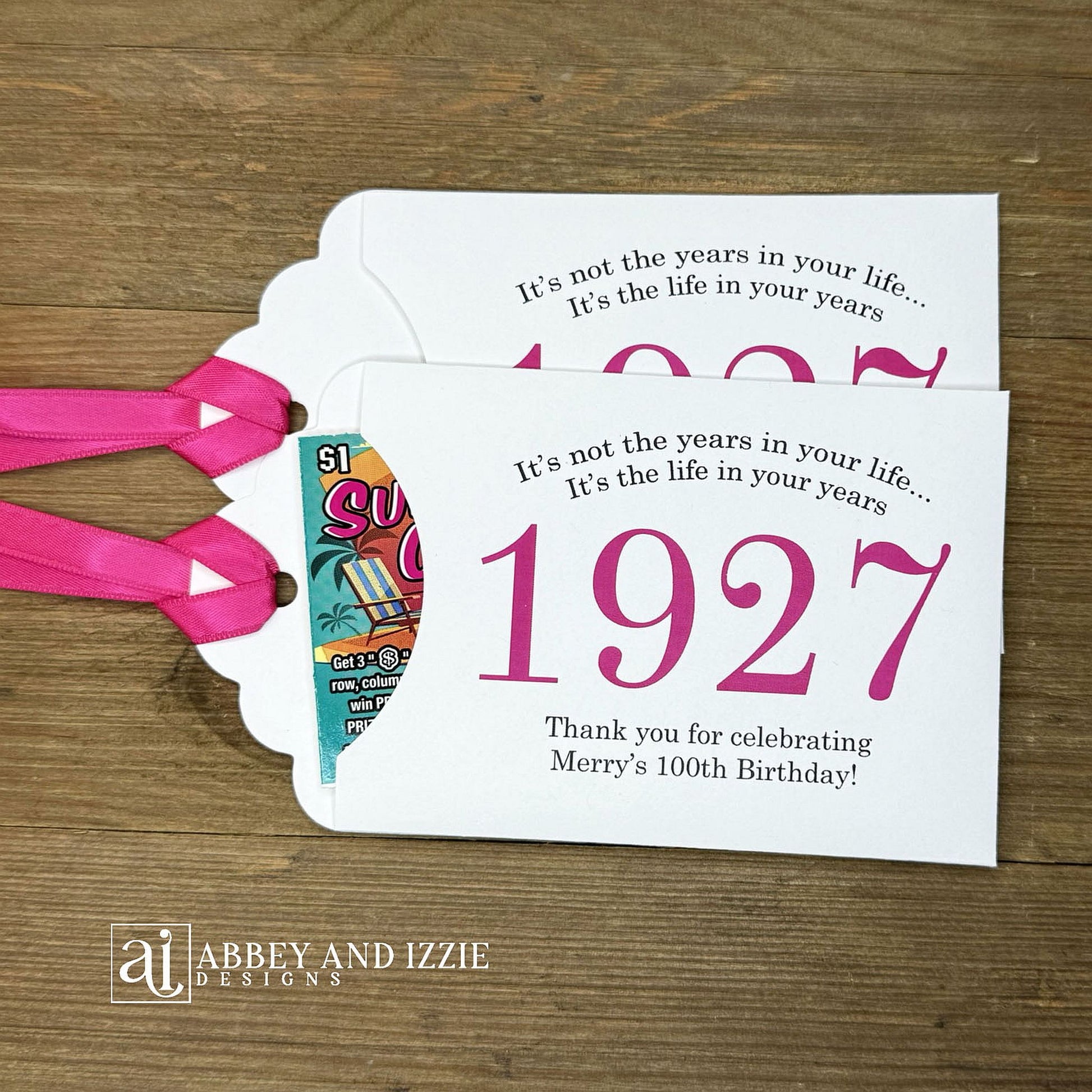 Our 100th birthday party favors are personalized for the guest of honor, your choice of ribbon color and year color. Always a fun ice breaker, slide a scratch off ticket in and see who is the winner! Each 100th birthday favor comes with the year the honoree was born printed in the center with 'It's not the years in your life...it's the life in your years' and happy birthday to the guest of honor. These can be made for any birthday year, 50th, 60th, 70th, 100th your choice. 100th Birthday Party Favors