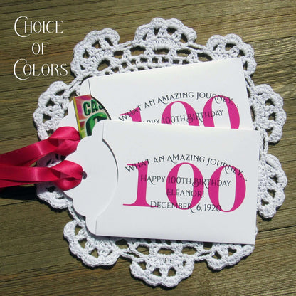These 100th birthday party favors are personalized for the honoree with name and birthdate.  Each envelope is printed on white card stock with your choice of colors to match your party theme.  Ribbon comes attached, slide a lottery ticket in the open end and see which guest wins.