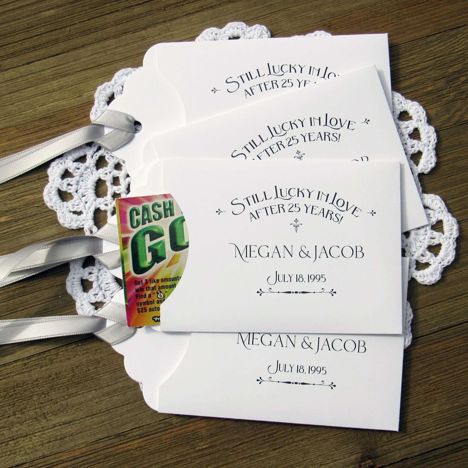 Still Lucky in Love 25th Anniversary Favors, slide a lottery ticket in and see who goes homes with the cash!  Your guests will appreciate these fun and easy silver anniversary party favors.