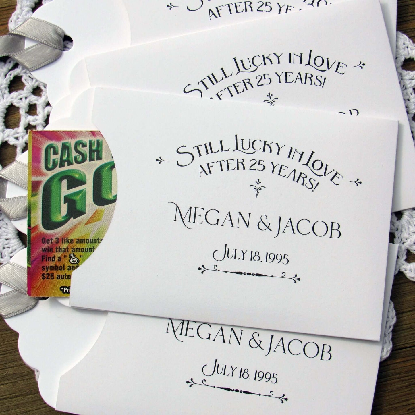 Still Lucky in Love 25th Anniversary Favors, slide a lottery ticket in and see who goes homes with the cash!  Your guests will appreciate these fun and easy silver anniversary party favors.