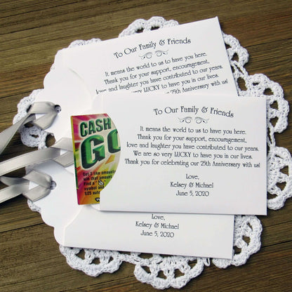 Lottery Ticket Envelopes for Wedding Anniversary Favors, these can be made for any anniversary year.  Shown here for a 25th Anniversary with silver ribbon printed on white envelopes. Slide a scratch off lotto in to see which guests win big.