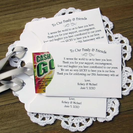 Lottery Ticket Envelopes for Wedding Anniversary Favors, these can be made for any anniversary year.  Shown here for a 25th Anniversary with silver ribbon printed on white envelopes. Slide a scratch off lotto in to see which guests win big.
