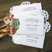 Our 50th wedding anniversary favors are personalized for the happy couple.  Still lucky in lover after 50 years printed on white envelopes with gold ribbon attached.  Slide a lottery ticket in the open end for a fun favor guest will love.