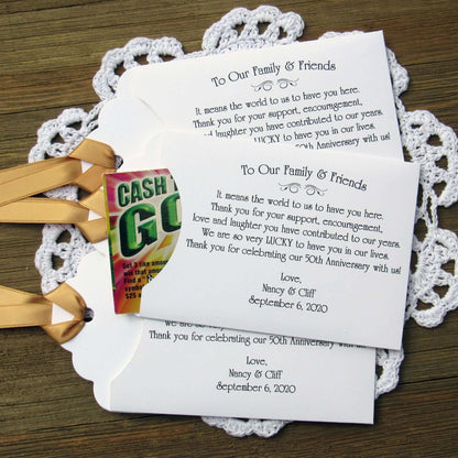 Personalized 50th Wedding Anniversary Party Favors, with a sweet saying to let your friends and family know how much they mean to you.  Printed on white envelopes with a gold ribbon attached.  