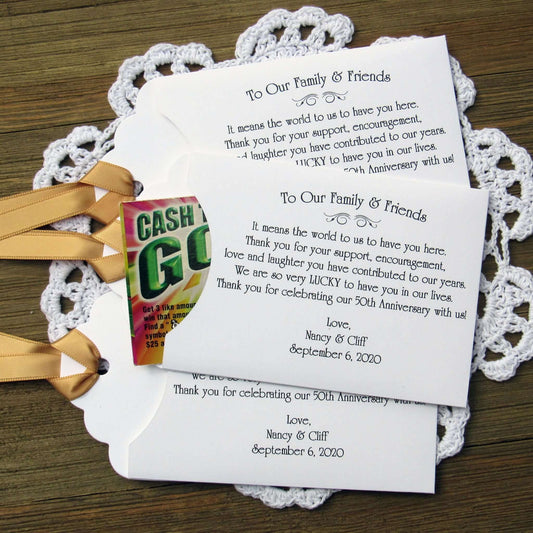 Personalized 50th Wedding Anniversary Party Favors, with a sweet saying to let your friends and family know how much they mean to you.  Printed on white envelopes with a gold ribbon attached.  
