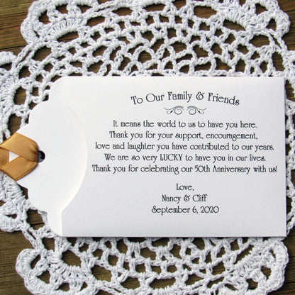 Personalized 50th Wedding Anniversary Party Favors, with a sweet saying to let your friends and family know how much they mean to you.  Printed on white envelopes with a gold ribbon attached.  
