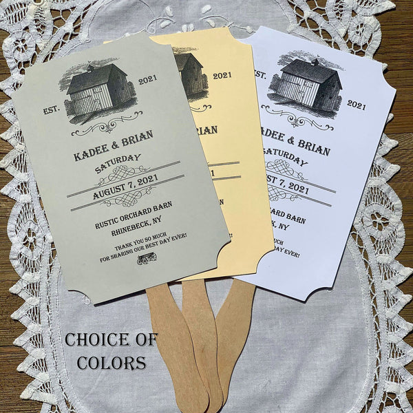 Barn wedding favor fans, personalized for the bride and groom.  Fans ship fully assembled, choice of ivory, white or gray.  Adorned with an old barn these are perfect for a barn wedding.
