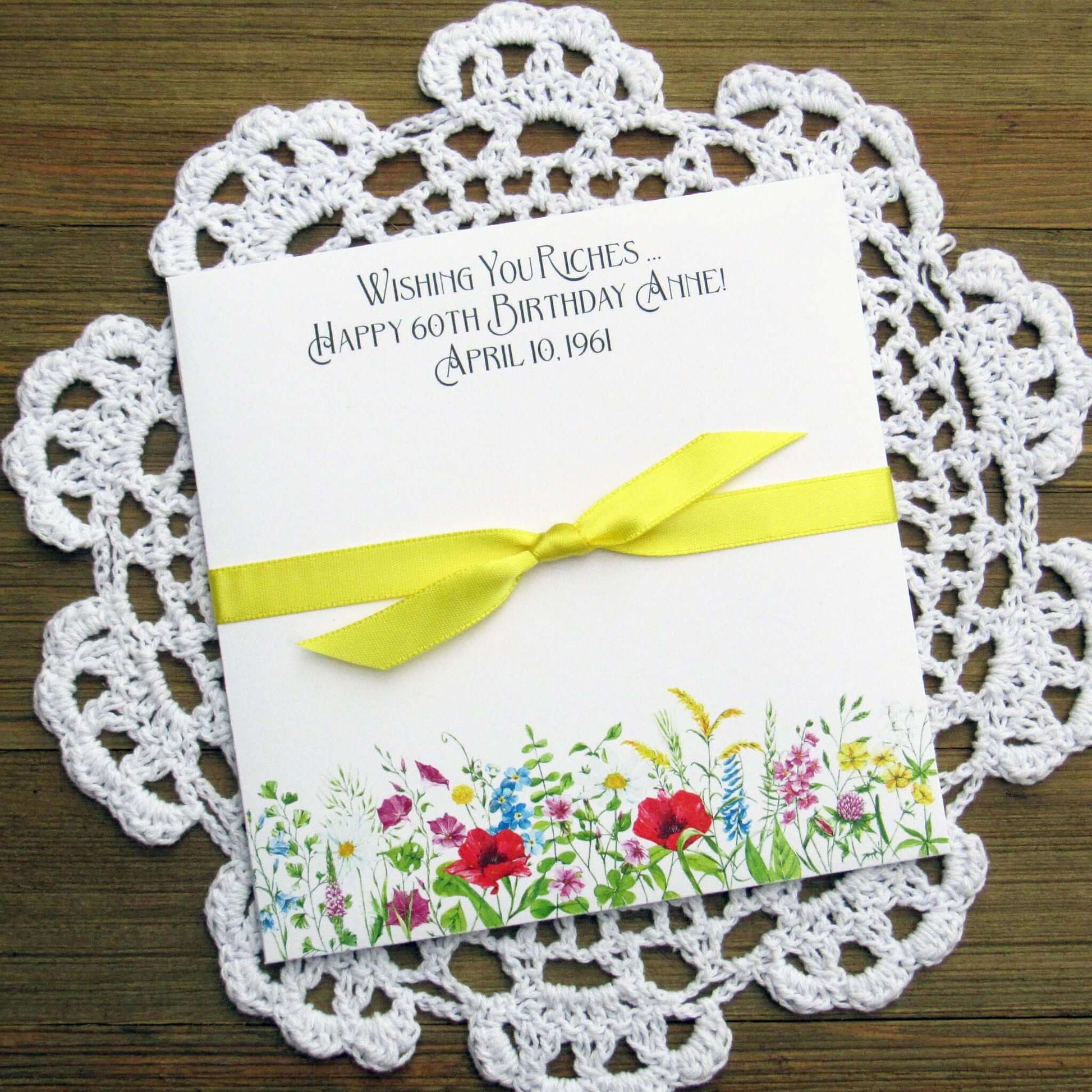 Adult Personalized Birthday Lottery Ticket Favors, slide a lotto ticket in these cute envelopes for a fun party favor.  Personalized with 'wishing you riches' and happy birthday to the guest of honor.  Adorned with wildflowers with your choice of coordinating ribbon.