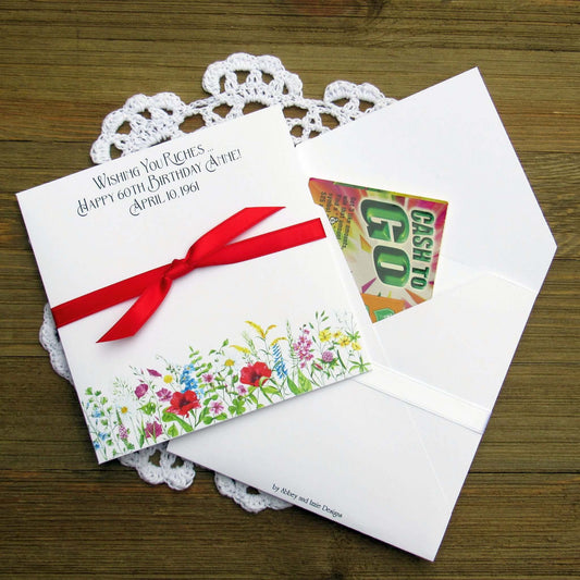 Adult Personalized Birthday Lottery Ticket Favors, slide a lotto ticket in these cute envelopes for a fun party favor.  Personalized with 'wishing you riches' and happy birthday to the guest of honor.  Adorned with wildflowers with your choice of coordinating ribbon.