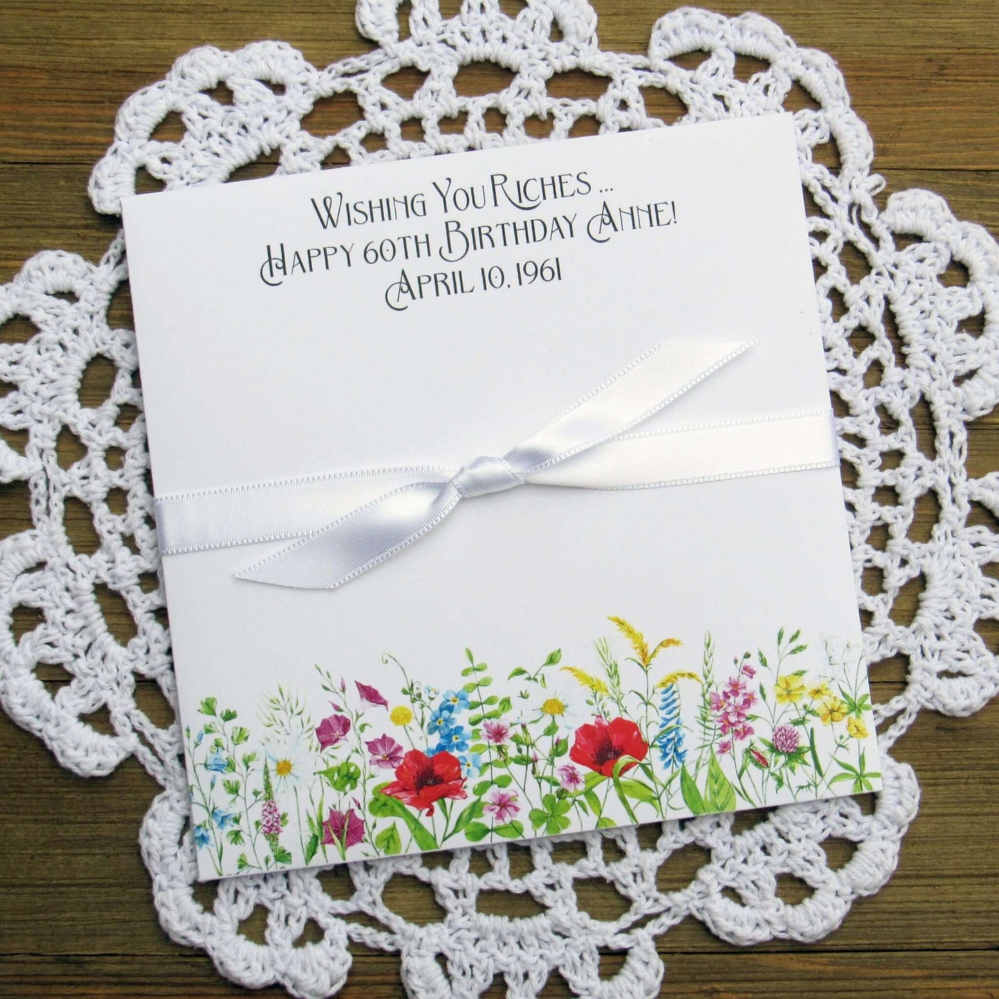 Adult Personalized Birthday Lottery Ticket Favors, slide a lotto ticket in these cute envelopes for a fun party favor.  Personalized with 'wishing you riches' and happy birthday to the guest of honor.  Adorned with wildflowers with your choice of coordinating ribbon.