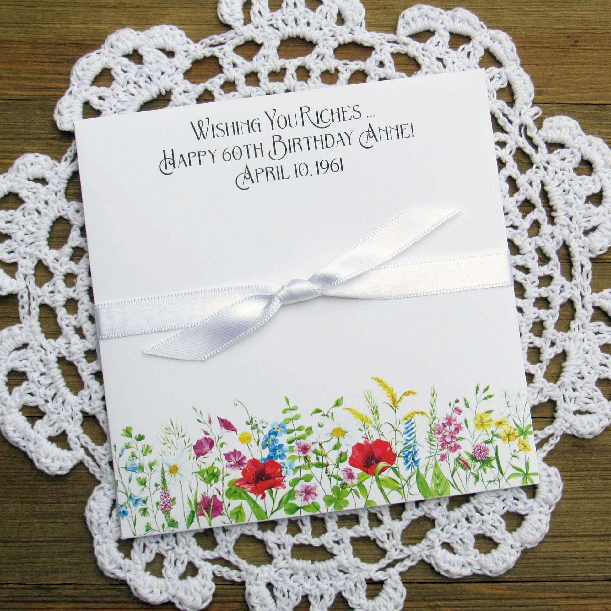 Adult Personalized Birthday Lottery Ticket Favors, slide a lotto ticket in these cute envelopes for a fun party favor.  Personalized with 'wishing you riches' and happy birthday to the guest of honor.  Adorned with wildflowers with your choice of coordinating ribbon.