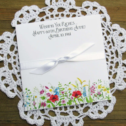 Adult Personalized Birthday Lottery Ticket Favors, slide a lotto ticket in these cute envelopes for a fun party favor.  Personalized with 'wishing you riches' and happy birthday to the guest of honor.  Adorned with wildflowers with your choice of coordinating ribbon.