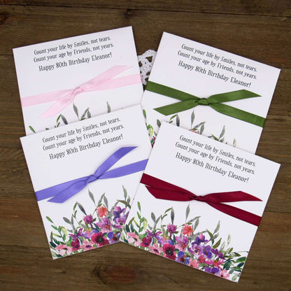 .Lavender Floral Personalized Birthday Party Favors for any birthday.  Large envelopes easy to slide in a scratch off lotto ticket to see which guest wins big.  Ribbon tied around the center comes attached.