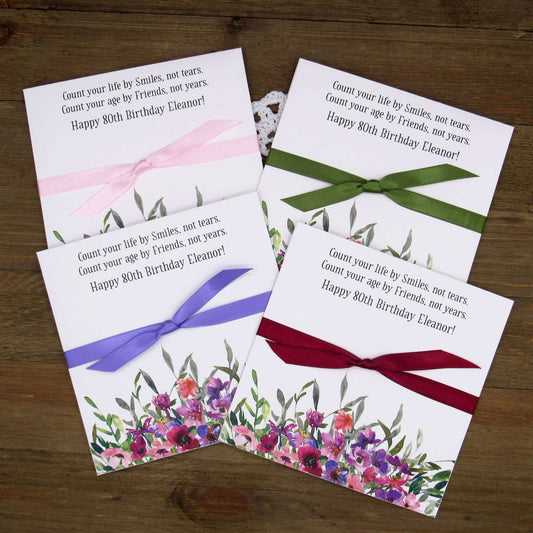 .Lavender Floral Personalized Birthday Party Favors for any birthday.  Large envelopes easy to slide in a scratch off lotto ticket to see which guest wins big.  Ribbon tied around the center comes attached.