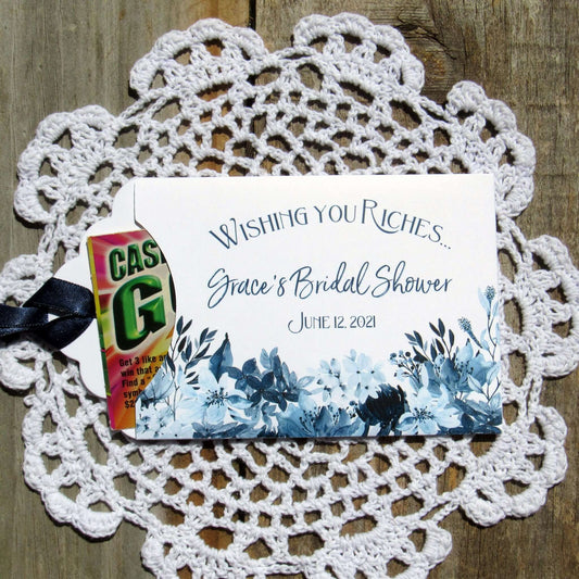 Navy Blue Bridal Shower Favors, personalized for the bride to be.  Small white envelopes adorned with navy flowers printed and a navy ribbon.  Slide a lotto ticket in for a fun bridal shower favor. 