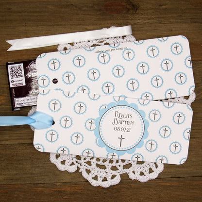 Personalized Baptism Party Favors for Baby Boys.  Printed on white card stock adorned with blue crosses with babies name and baptism date.  Choice of light blue or white ribbon which is included and left off for easy filling.  Slide a candy bar in the open end and tie the ribbon.