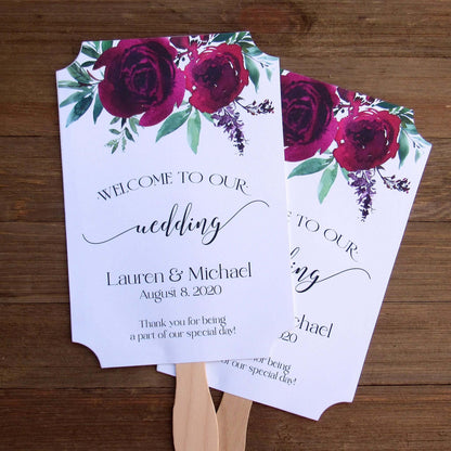 Burgundy Personalized Wedding Fans with the bride and grooms name and wedding date.  Printed on white card stock, two side with handle hidden between, printing on one side only.  Shipped to you assembled and ready for your special day.