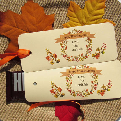 Thanksgiving Table Candy Favors that are personalized for a elegant touch.  Constructed from ivory card stock, these are sturdy candy bar favors, just slide the candy bar in the open end and tie the ribbon on.  
