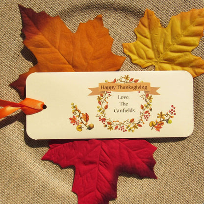 Thanksgiving Table Candy Favors that are personalized for a elegant touch.  Constructed from ivory card stock, these are sturdy candy bar favors, just slide the candy bar in the open end and tie the ribbon on.  