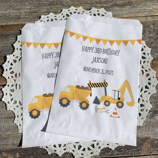 Construction Birthday Favor Bags personalized for the guest of honor!  Printed on white bags with large construction equipment, these are perfect size for any treats.