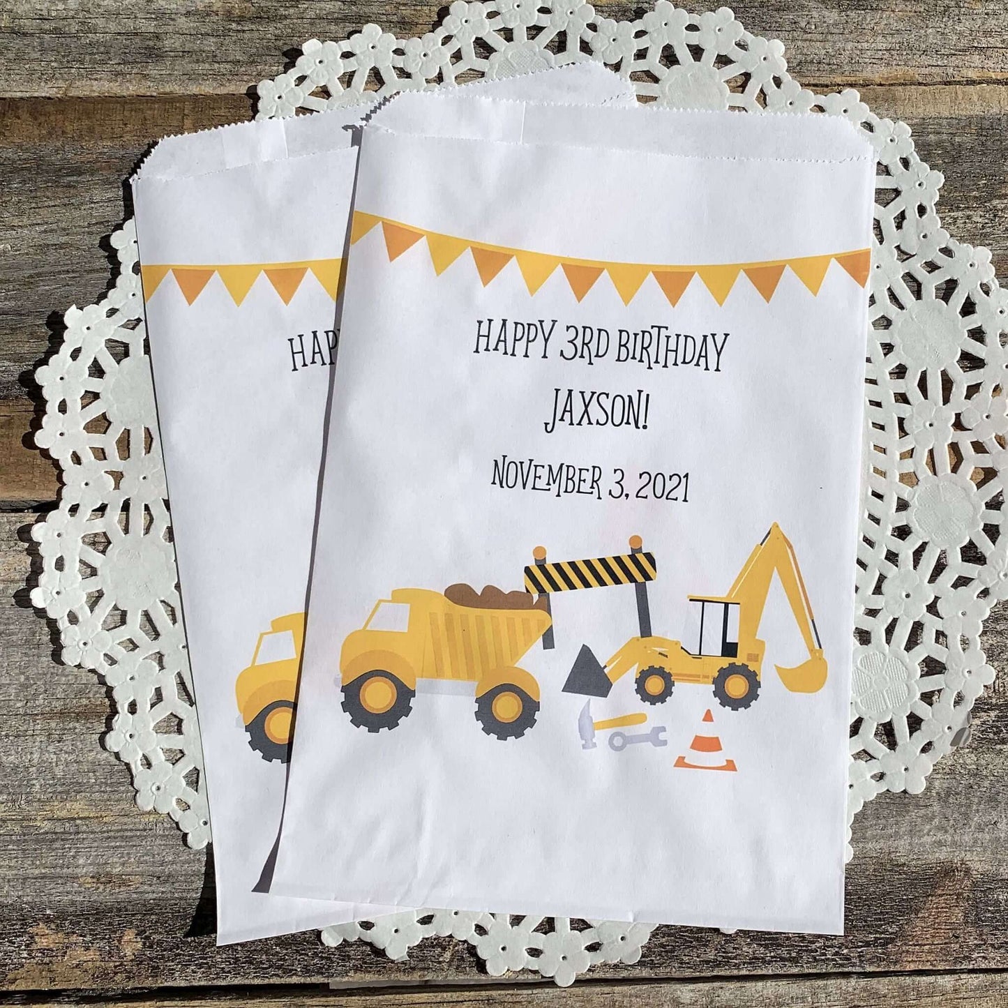 Construction Birthday Favor Bags personalized for the guest of honor!  Printed on white bags with large construction equipment, these are perfect size for any treats.  