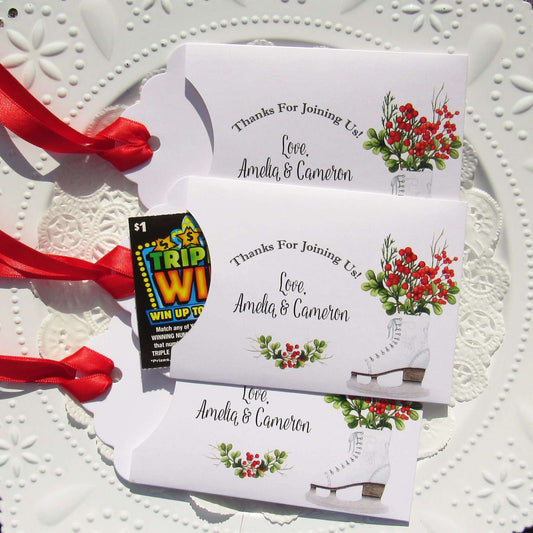 Winter Wedding Favors Personalized for the bride and groom.  Printed on white envelopes with red ribbon attached.  Slide a lottery ticket in to see which guest wins.