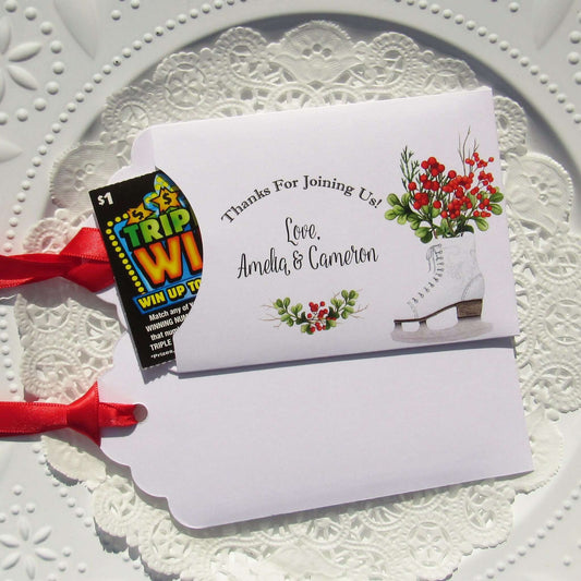 Winter Wedding Favors Personalized for the bride and groom.  Printed on white envelopes with red ribbon attached.  Slide a lottery ticket in to see which guest wins.