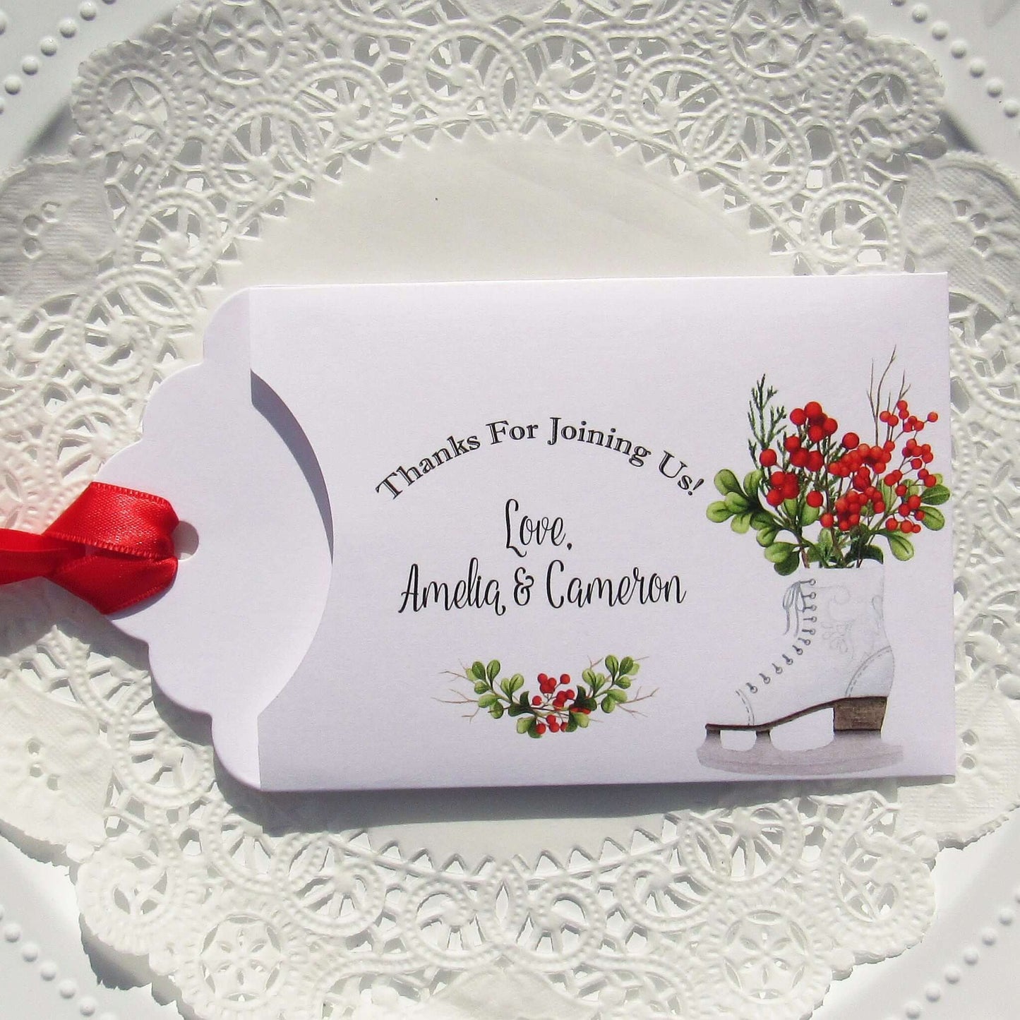 Winter Wedding Favors Personalized for the bride and groom.  Printed on white envelopes with red ribbon attached.  Slide a lottery ticket in to see which guest wins.