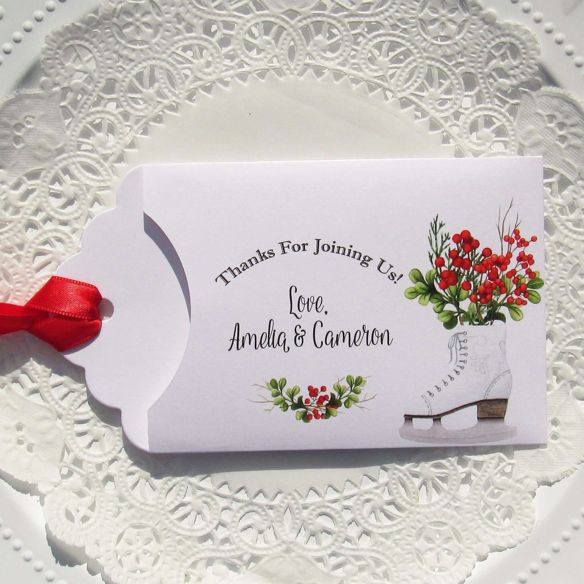 Winter Wedding Favors Personalized for the bride and groom.  Printed on white envelopes with red ribbon attached.  Slide a lottery ticket in to see which guest wins.