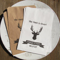 Personalized rustic wedding favor bags adorned with a deer head,