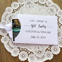 Eat, Drink & Get Lucky lotto ticket wedding favors.  Personalized lottery ticket envelopes, slide a scratch off lotto ticket in for fun and easy wedding guest favors.  Choice of envelope and ribbon color.