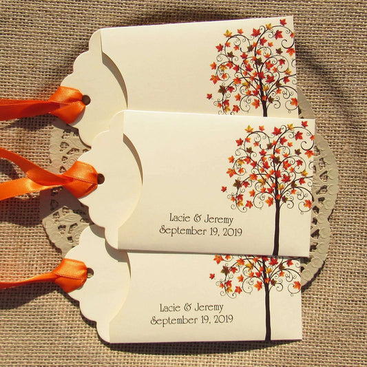 Fall Tree Wedding Guest Favors Personalized for your special day.  Lottery ticket envelopes for wedding favors, slide a lotto ticket in the open end to see who wins.  Envelopes are printed on ivory card stock with ribbon attached.  Adorned with a fall tree for some autumn color.
