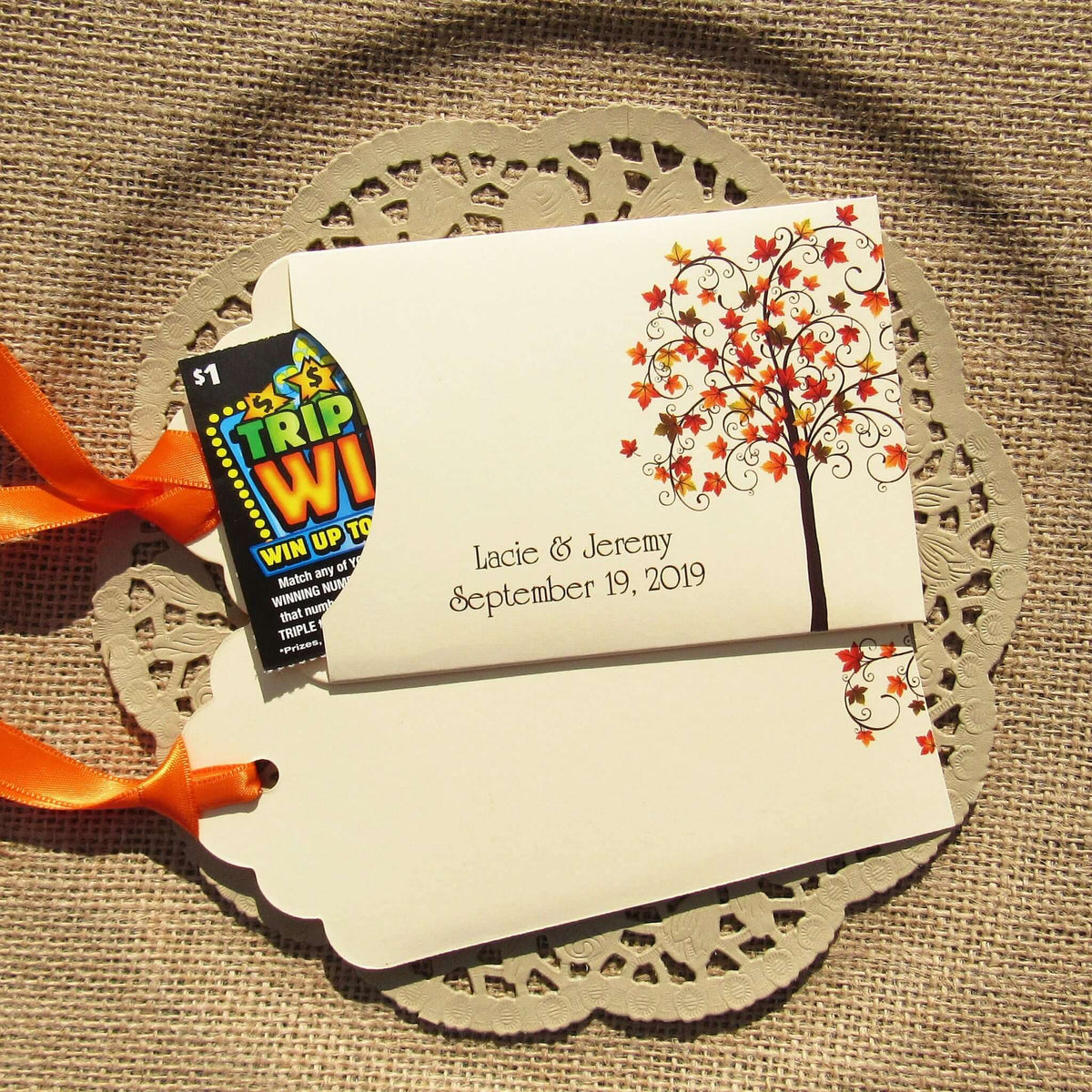 Fall Tree Wedding Guest Favors Personalized for your special day.  Lottery ticket envelopes for wedding favors, slide a lotto ticket in the open end to see who wins.  Envelopes are printed on ivory card stock with ribbon attached.  Adorned with a fall tree for some autumn color.