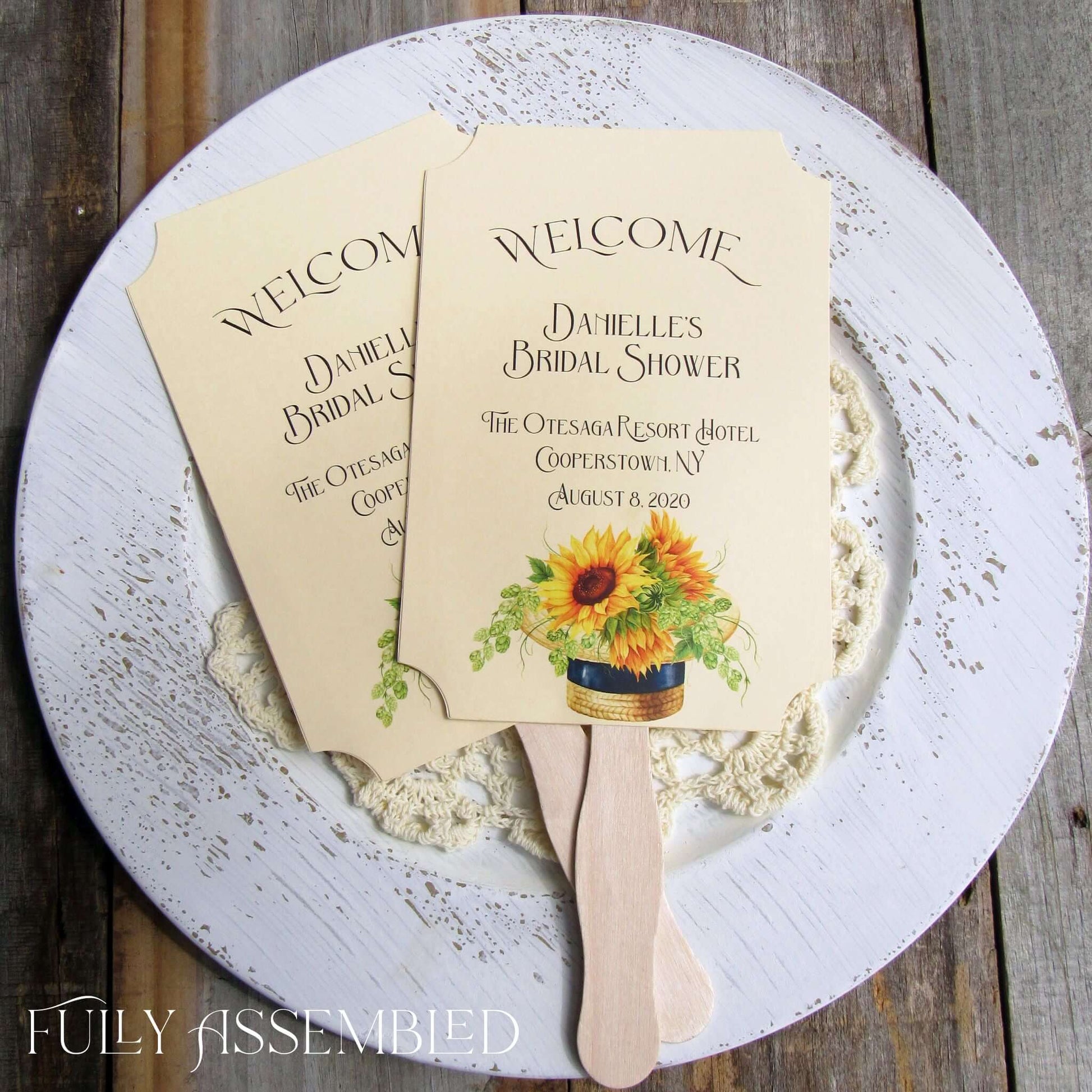 Sunflower Bridal Shower Favor Fans personalized for the bride to be.  Fans are printed on ivory cardstock adornerd with a beautiful sunflower motif.  Shipped to you assembled and ready for your event.  Fans have a wooden handle and are two sided with handle hidden, printing on one side only.