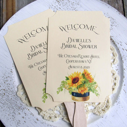 Sunflower Bridal Shower Favor Fans personalized for the bride to be.  Fans are printed on ivory cardstock adornerd with a beautiful sunflower motif.  Shipped to you assembled and ready for your event.  Fans have a wooden handle and are two sided with handle hidden, printing on one side only.